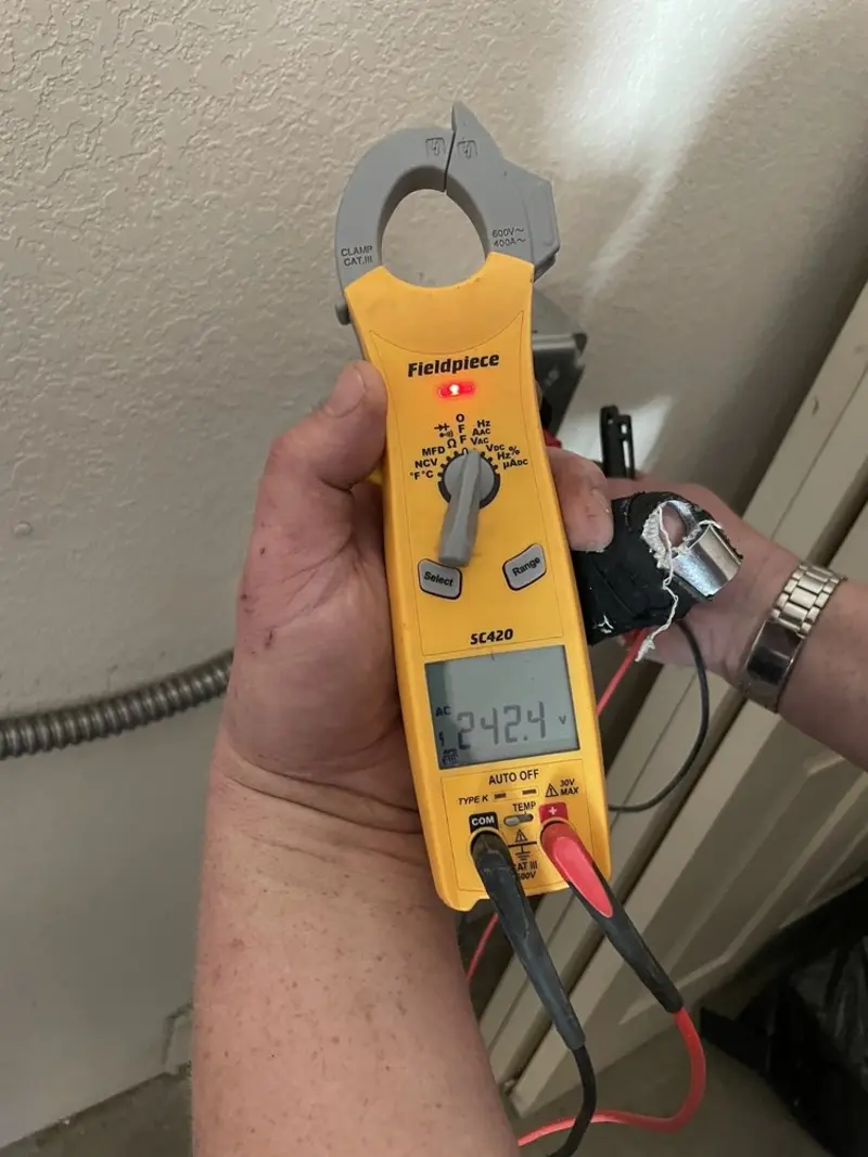 Voltage testing with clamp meter during Ceiling Fan Installation in South Laurel